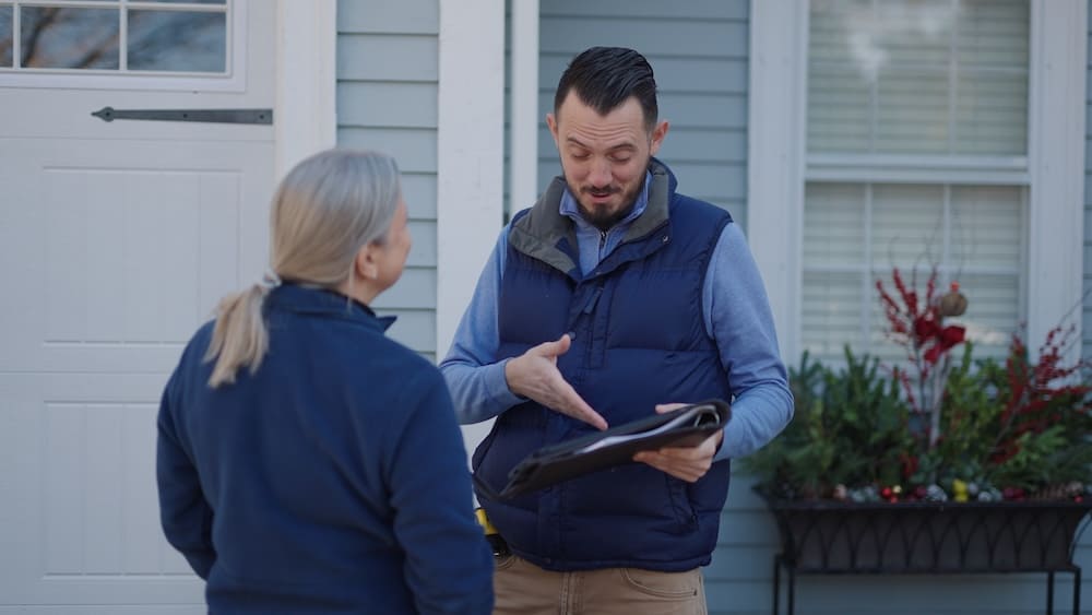 Blue Bear Plumbing, Heating, and Air employee performing an HVAC tune-up