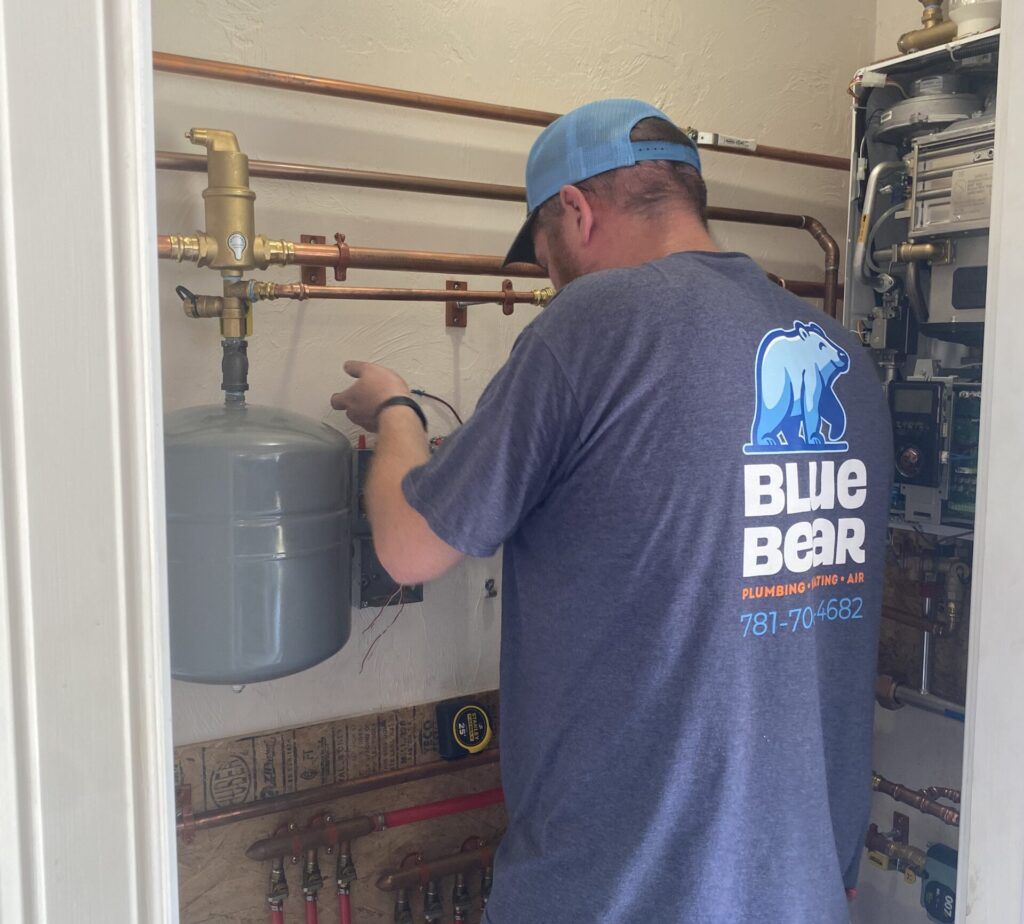 Blue Bear technician working on Rehoboth, MA, home's HVAC system